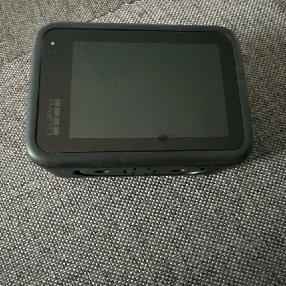 Go Pro 11 black camera with 12 piece accessories. - Picture 2 of 12